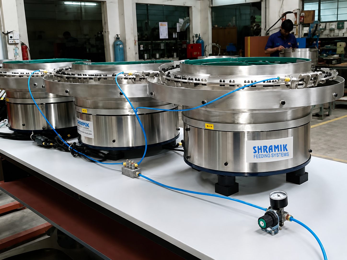 Shramik vibratory feeder system on production line